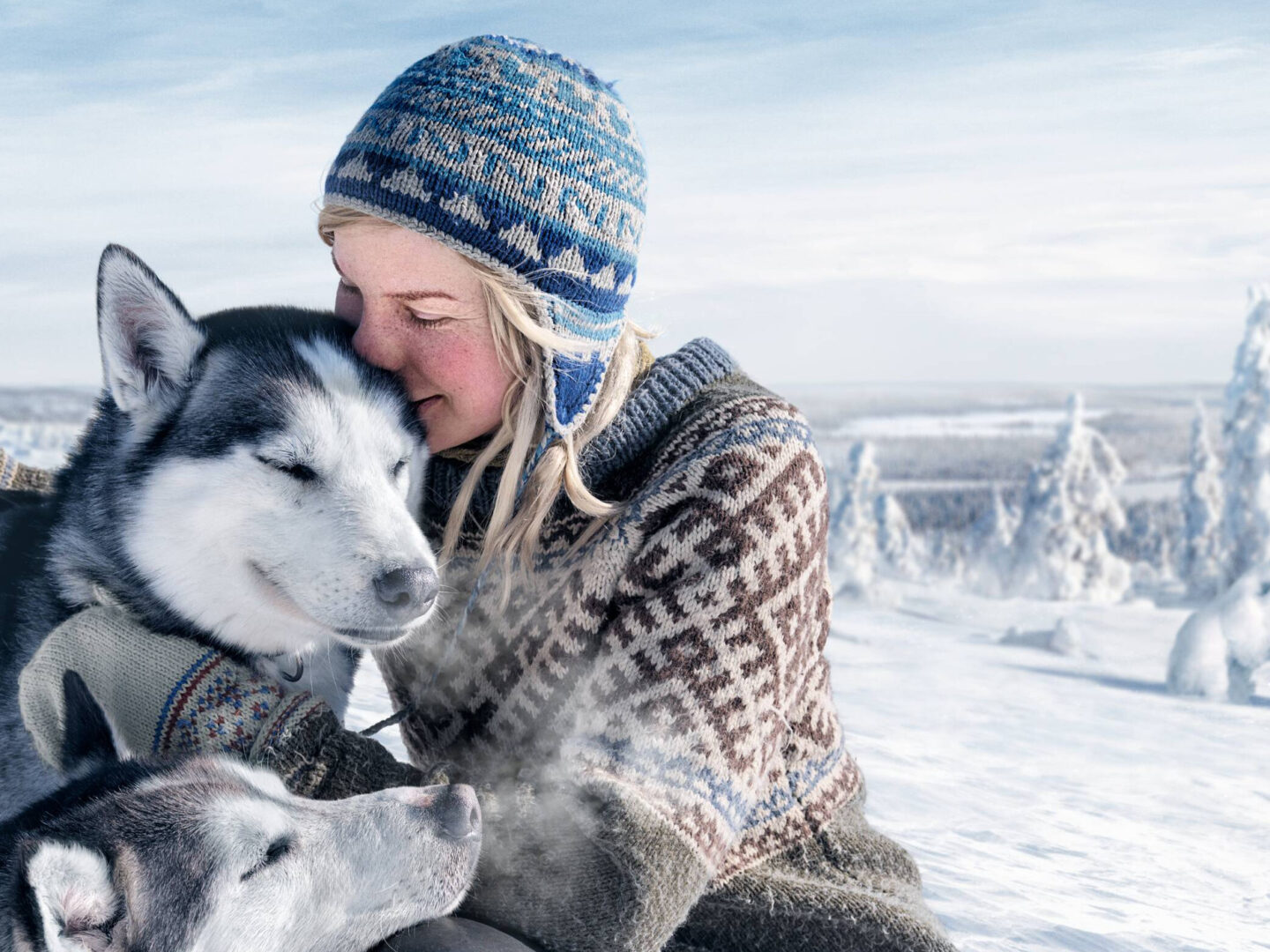 Frau mit Huskies
